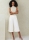 Model is wearing loose Misses pants, palazzo pants, also as culottes sewn with the sewing pattern Vogue 2094