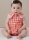 Model is wearing sweet Baby romper with buttons sewn with the sewing pattern Butterick 7048