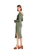 Model is wearing figure-hugging Dress with side slit sewn with the sewing pattern Burda 5738