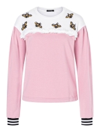 Model is wearing romantic misses sweater with dropped shoulders and round neckline sewn with the sewing pattern Burda 5650
